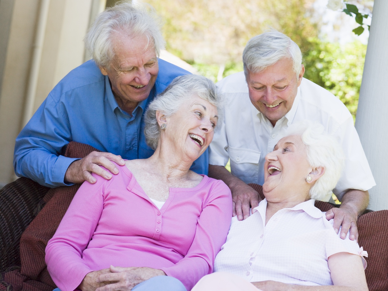 Elderly people laughing in each others' company